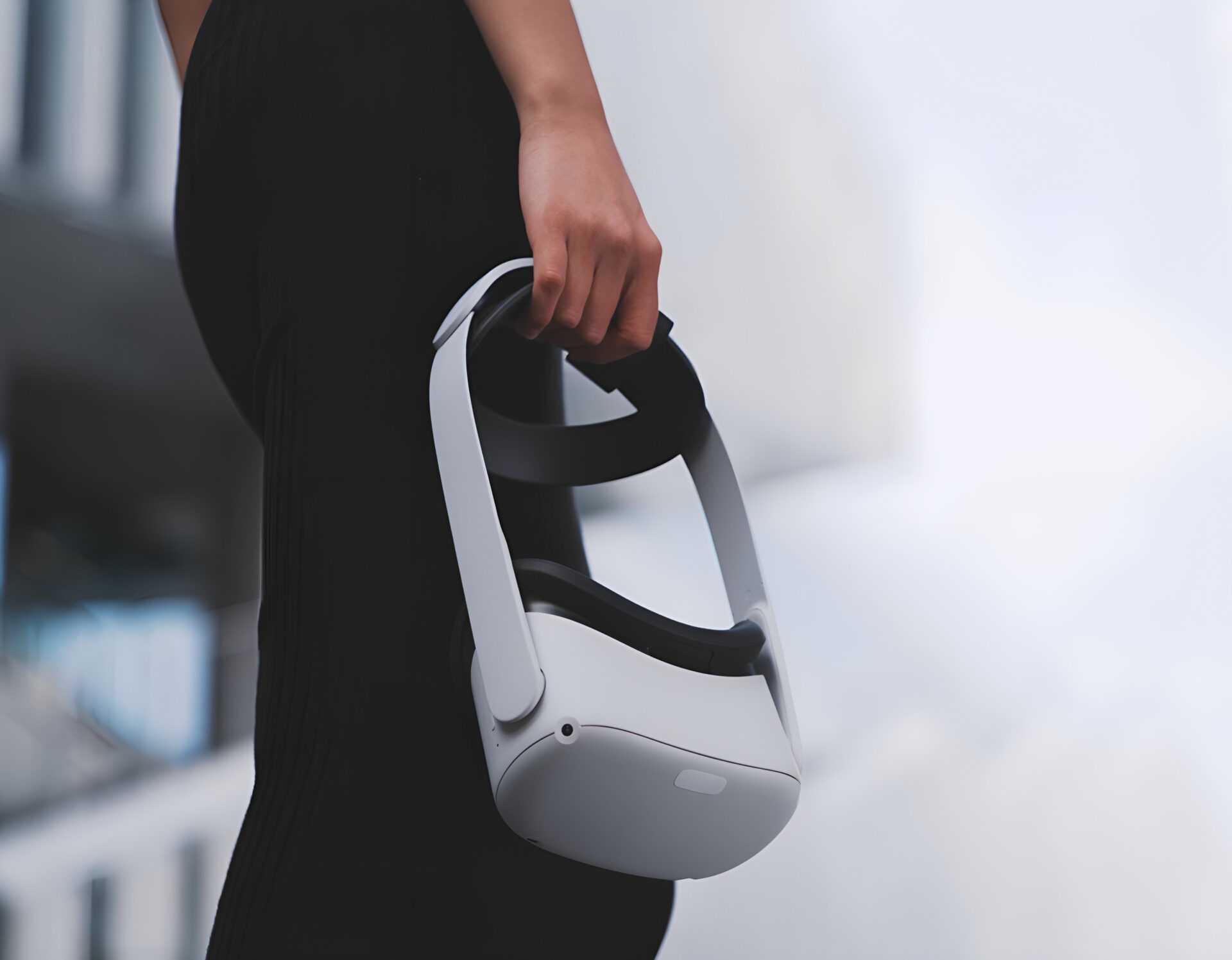 A girl holding a VR headset